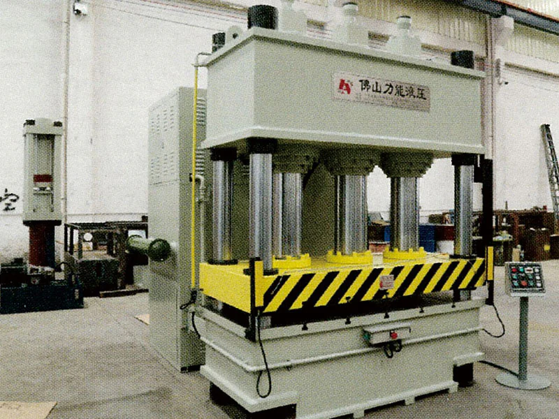 Front view of a frame hydraulic press in the workshop