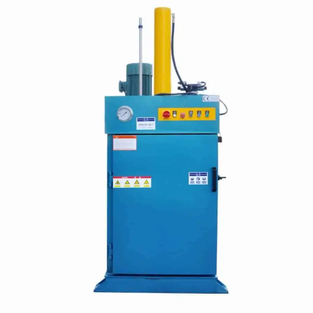 Front view of a blue oil drum baler with its chamber closed
