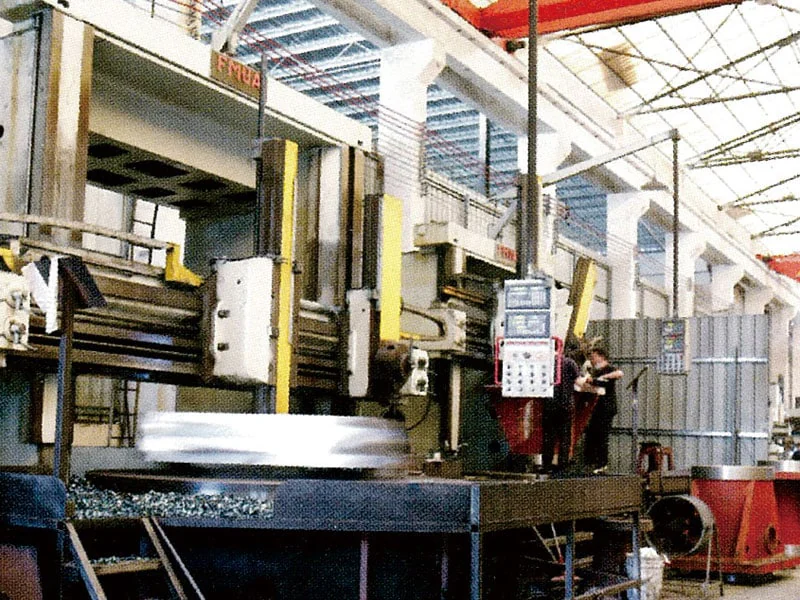 Large press machinery inside the manufacturing workshop